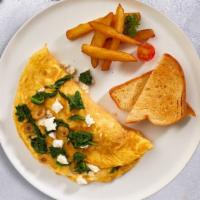 Mediterranean Omelette · Three eggs, black olives, feta cheese, spinach cooked as an omelette served with hash brown,...