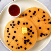 Chocolate Pancakes · Fluffy chocolate chip pancakes cooked with care and love served with butter and maple syrup.