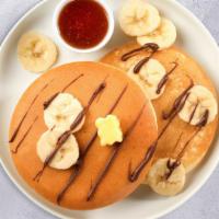 Banana Pancakes · Fluffy banana pancakes cooked with care and love served with butter and maple syrup. Served ...