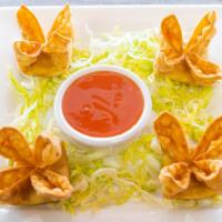 Crab Rangoon · Four pieces. Imitation crab meat, garlic, and cream cheese. Served with plum sauce.