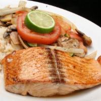 Grilled Salmon · With white rice, sauteed vegetables & garlic bread.
