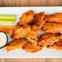 Wings · Wings drenched in your sauce of choice served with carrots and celery and your choice of ble...