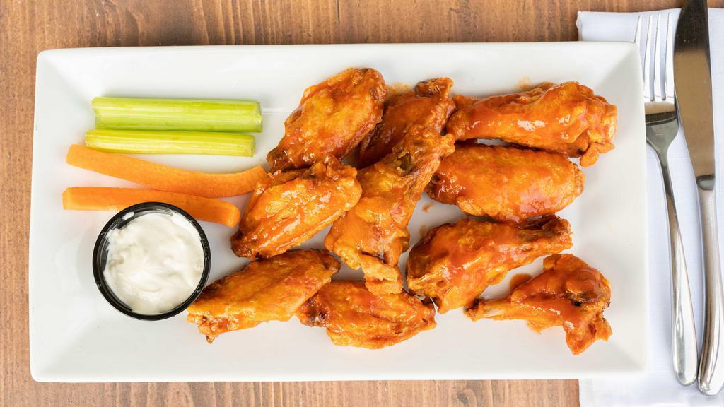 Wings · Wings drenched in your sauce of choice served with carrots and celery and your choice of bleu cheese or ranch dressing.