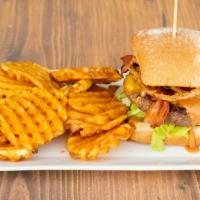 Western Burger · Our juicy burger patty topped with melted cheddar cheese, crispy bacon, onion tangles, shred...