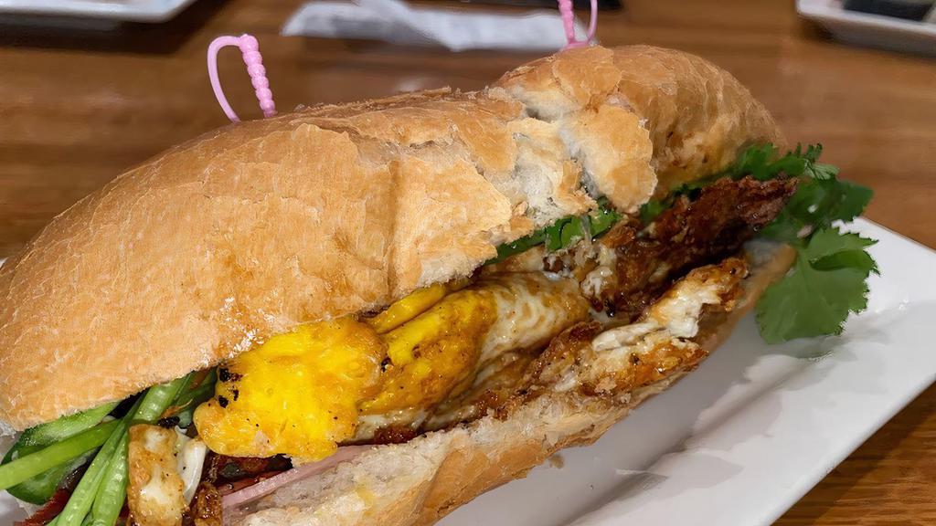 Lotus Banh Mi · Loaded with grilled pork, BBQ park, and a fried egg.