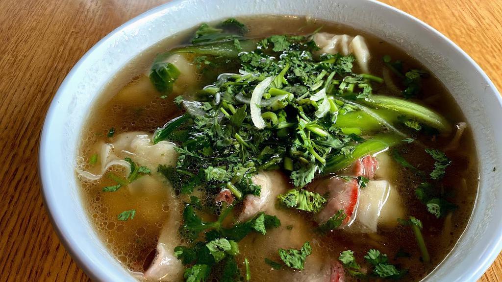 Wonton Soup · Clear vegetarian broth served with pork wontons, egg noodles, BBQ pork, green onions, and cilantro.