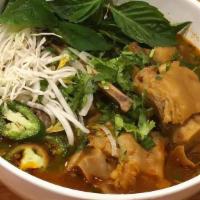 Mom'S Bun Bo Hue  · Spicy vegetarian broth served with rice noodles, beef, pork and 2 PIG FEET, cilantro, green ...