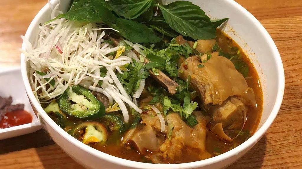 Mom'S Bun Bo Hue  · Spicy vegetarian broth served with rice noodles, beef, pork and 2 PIG FEET, cilantro, green onions and a side of beansprouts, basil, jalapenos, and limes.