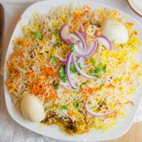 Chicken Dum Biryani · Flavored basmati rice cooked with chicken and a whole lot of spices.