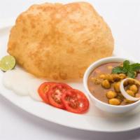 Chole Bhature · A tangy chickpea curry served with your choice of naan, roti, poori or bhatura (deep fried l...