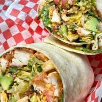 Buffalo Chicken Wrap · Chicken tenders tossed in buffalo sauce and mixed with romaine lettuce, bacon, tomato, avoca...