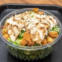 Caesar Salad · Romaine lettuce, shredded parmesan cheese, and housemade seasoned croutons served with Caesa...