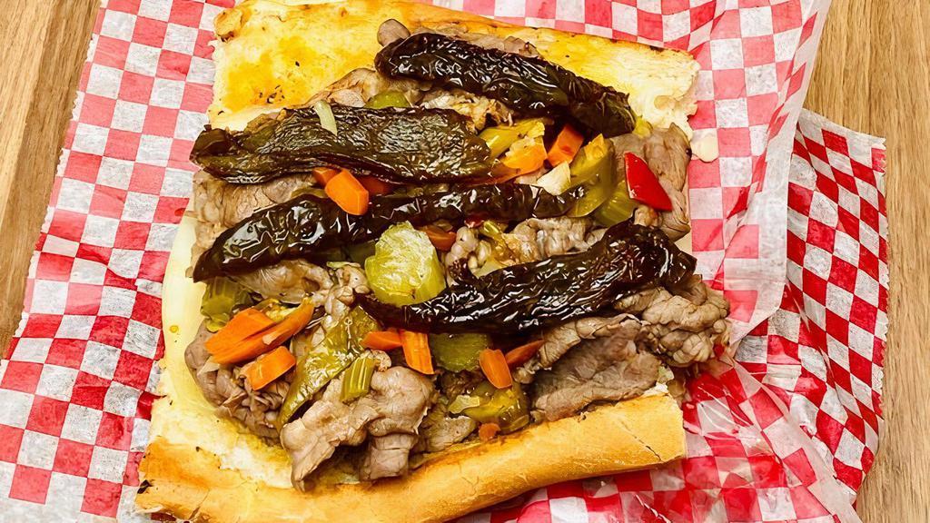 Italian Beef · Classic Chicagoland staple of thinly sliced beef and a zesty au jus on our house baked french bread. Get it dipped, add sweet or hot peppers, cheese