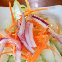 Cucumber Salad · Fresh cucumber, carrot, red onions with light sweet and sour dressing.
