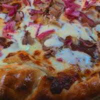 Philly Pizza · Hand stretched Orsi's dough, parmesan garlic sauce, fresh house roasted beef, mozzarella che...