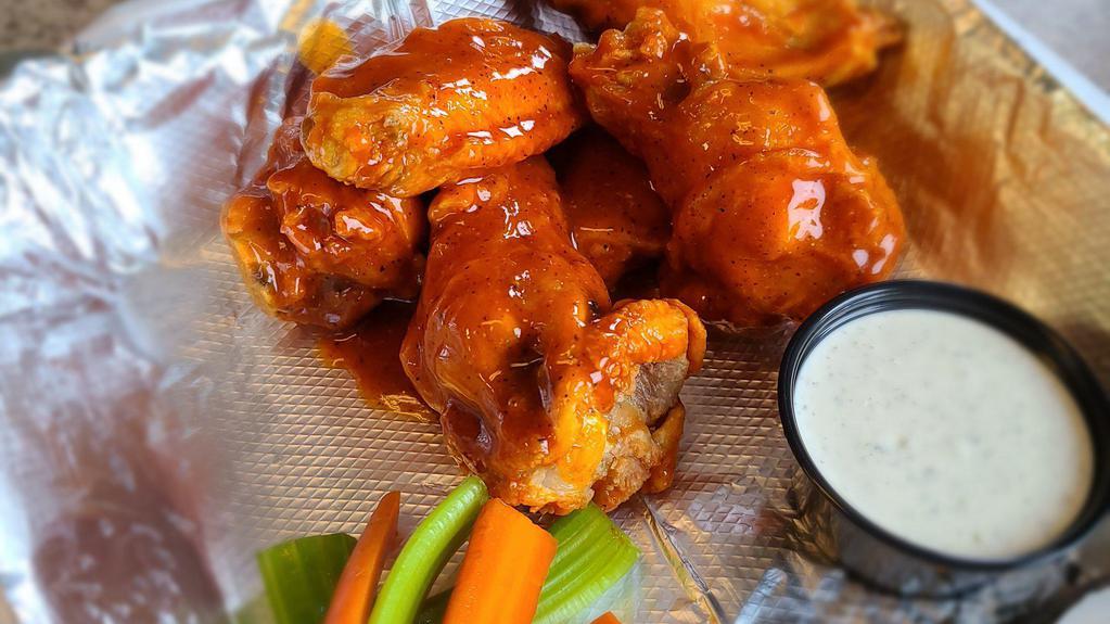 Buffalo Wings (Medium) · Jumbo wings tossed in our Classic Buffalo sauce.