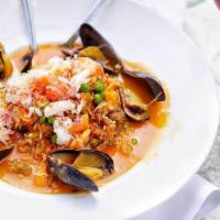 En Fuego · Hot. Variety of fish, shrimp, mussels, sausage, basmati rice, vegetables, lobster saffron br...
