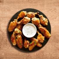 Classic Hot Wings (12 Pcs) · Buffalo style chicken wings deep-fried and then dipped in a choice of mild, medium or hot sa...