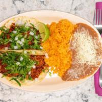 Taco Combo · Two tacos served with rice, beans and a can of pop