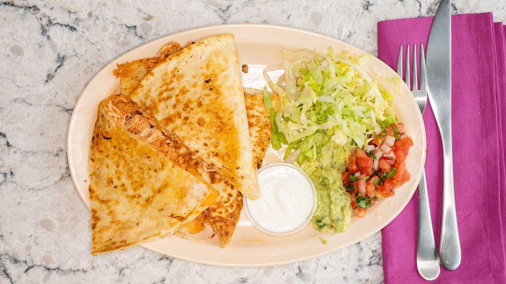 Quesadilla  · Flour tortilla, filled with cheese and choice of meat, on the side lettuce, pico de gallo, guacamole