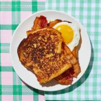 Le Bacon, Egg, And Cheese French Toast Sandwich · Get ready to be “le stuffed.” Bacon, fried egg, and cheddar cheese sandwiched between 2 slic...