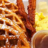 Waffle Deluxe · Belgian style waffle with side of maple syrup and butter, scrambled eggs and your choice of ...