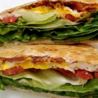 Belt Pocket · Bacon, fried eggs, lettuce, tomato, cheddar cheese and sriracha mayo on a flour tortilla.