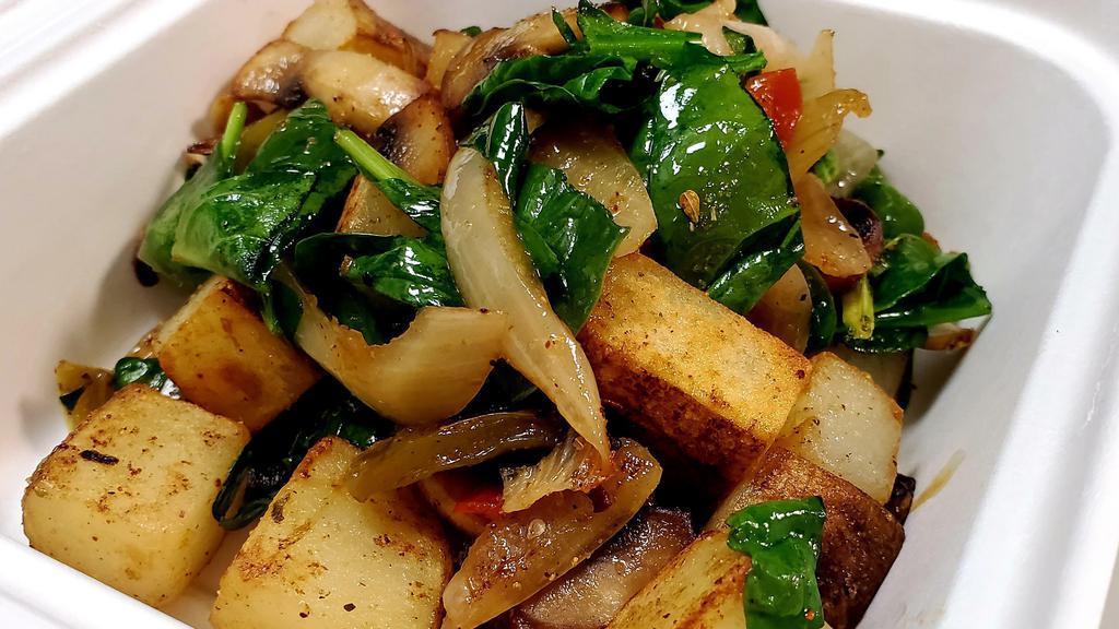 Hash · Seasoned potatoes, sautéed bell peppers and onions, mushrooms and spinach.