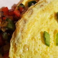 Garden Omelette · Eggs, red and green bell peppers, mushrooms, onions, spinach and Chihuahua cheese.