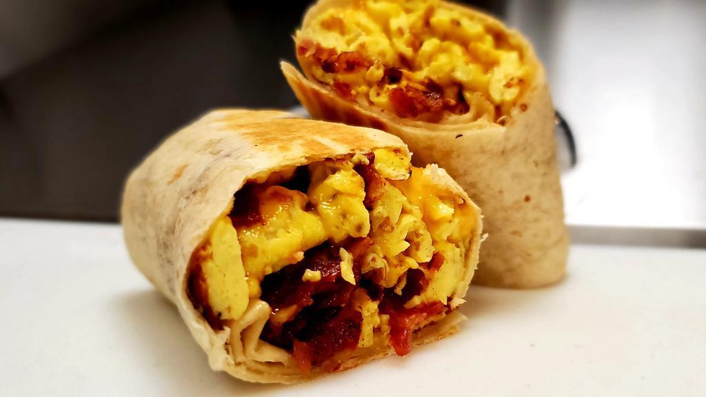 Bacon Egg And Cheese Burrito  · Bacon egg & american cheese and home fries burrito, wrap in a 10