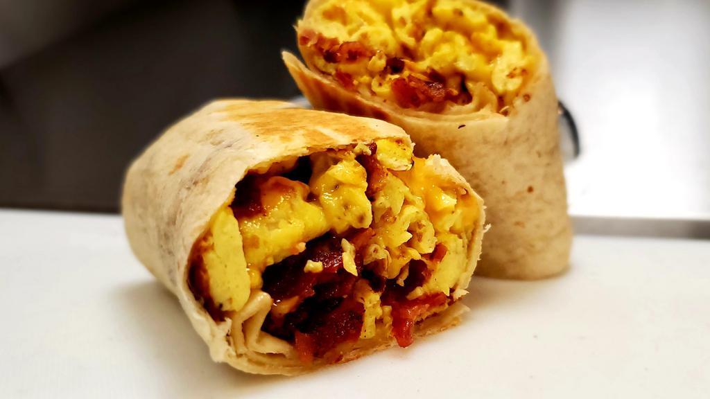 Sausage Egg And Cheese Burrito  · Sausage egg & american cheese and home fries burrito, wrap in a 10