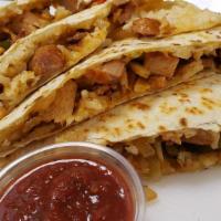 Loaded Quesadilla · Cheese, chicken, fajitas and white rice on a flour tortilla with house made salsa and pico d...