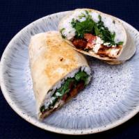 Caesar Wrap · White rice, kale and spinach mix, tomatoes, parm cheese and caesar dressing on a  flour tort...