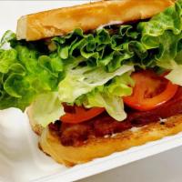 Blt Sandwich  · Applewood smoked bacon, lettuce, tomatoes and mayo on a house baked bread.