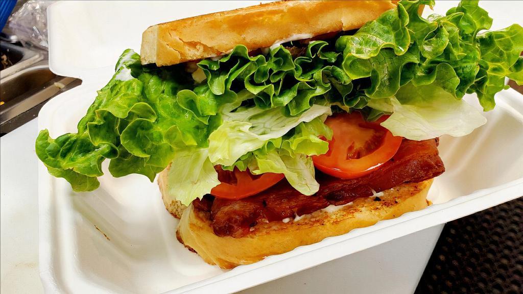 Blt Sandwich  · Applewood smoked bacon, lettuce, tomatoes and mayo on a house baked bread.