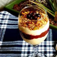 Granola Fruity Parfait · Organic Greek yogurt and house made fresh organic berry fruit seasonal compote topped with h...