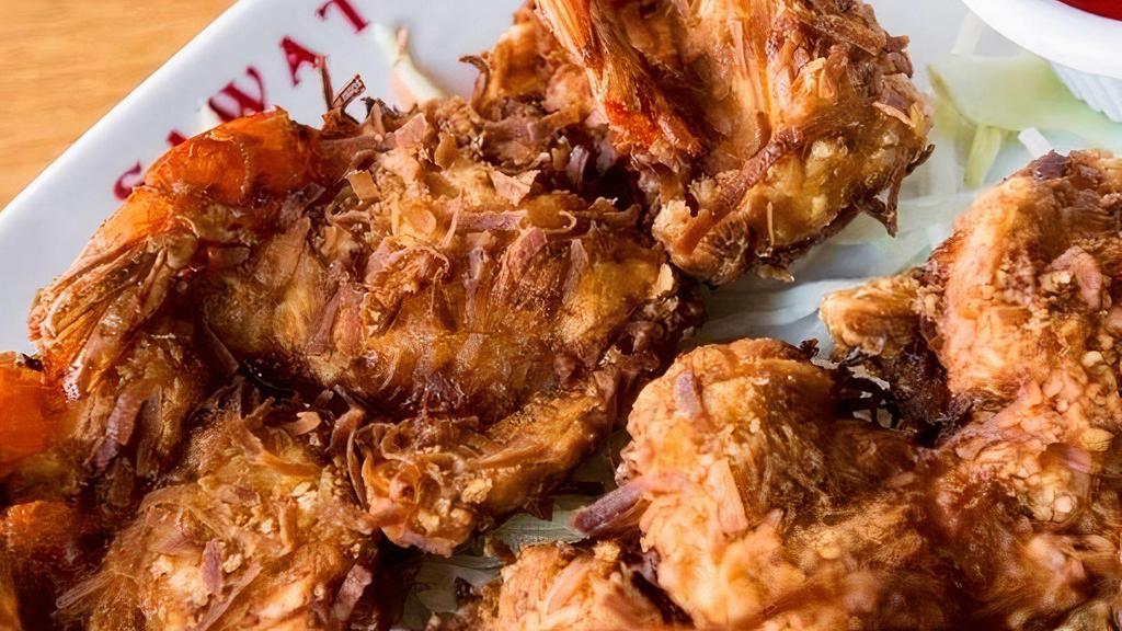#9 Coconut Shrimp · Six shrimp rolled in sweet coconut tempura batter & fried