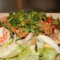 #21 Yum Yai Thai Salad · Thai version of ‘Chef Salad.’ Crisp vegetables, sliced hard-boiled egg, shrimp & chicken. To...