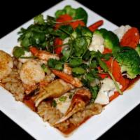 Sp5 Fishermans Delight · Shrimp, scallops, squid & crab claws stir-fried with spicy red curry. Served with steamed ve...