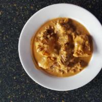 #25 Massamun Curry · Tender meat simmered in a tasty curry with potatoes & peanuts.