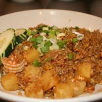#56 Tropical Fried Rice · Rice stir-fried with egg and pineapple. Topped with green onions.