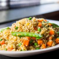 #55B Curry Fried Rice · Rice stir-fried with egg, yellow curry, carrots, peas & peapods. Topped with green onions.