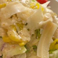 Greek Salad · Fresh-cut Lettuce Blend, Olives, Feta Cheese, Cherry Tomatoes, Banana Peppers, Parmesan Chee...