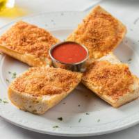 Garlic Bread · crusty bread coated with fresh garlic cloves which have been soaking in extra virgin olive o...