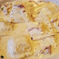 Lobster Raviolis  · Homemade lobster raviolis in a creamy mascarpone cheese sauce and sun dried tomato