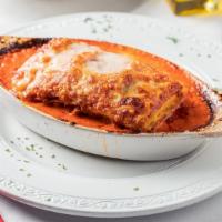 Lasagne Caro Mío  · Homemade lasagne, made from ground beef and ricotta cheese, baked in a creamy bolognese sauc...