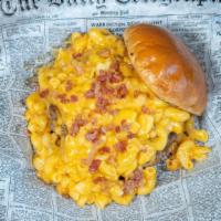 Slugger Burger · Double cheddar cheese burger topped with homemade mac and cheese and applewood bacon bites.