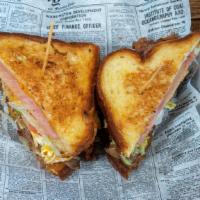 Hangover Burger · Two grilled cheese with hickory smoked ham, topped with two all natural beef patties, carame...