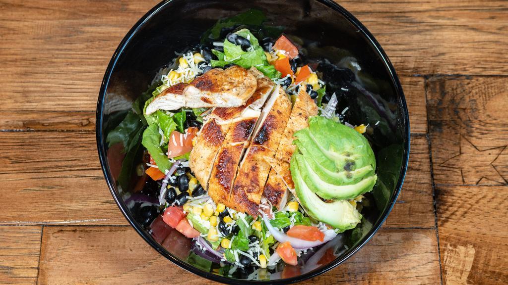 Southern Salad · Crispy romaine lettuce, tomatoes, red onions, corn, black beans, avocado, Monterrey jack cheese, and grilled chicken breast with a side of our Southwest chipotle dressing.