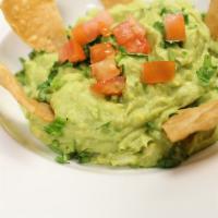 Guacamole & Chips · Avocados, tomatoes, onions, lime and serrano! Served with our hand cut chips.
